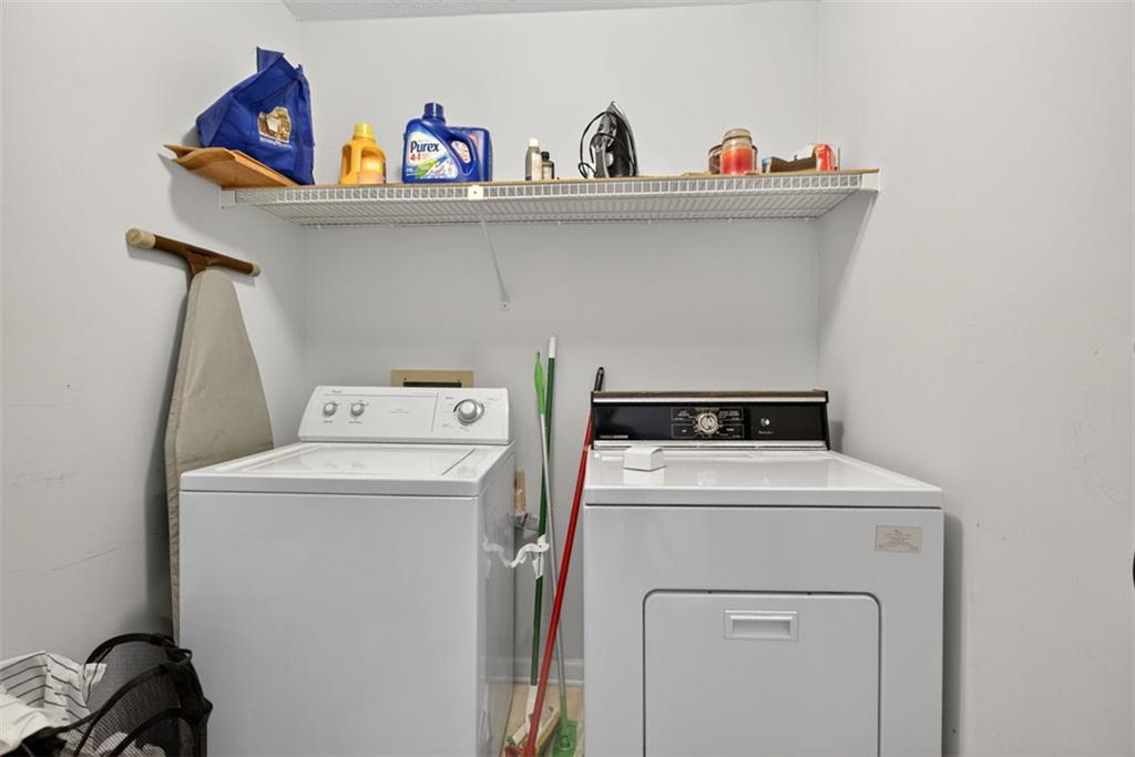 2222 Amber Creek Trail Buford, GA 30519 - Photo 25 of 51 a utility room with dryer and washer