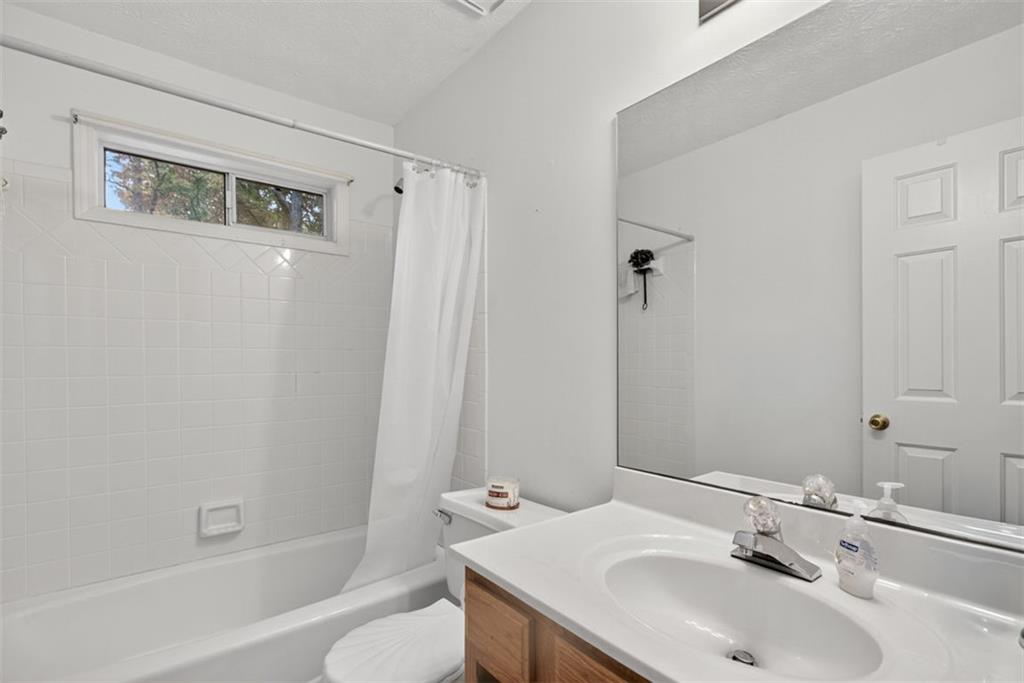 2222 Amber Creek Trail Buford, GA 30519 - Photo 29 of 51 a bathroom with a sink toilet and shower