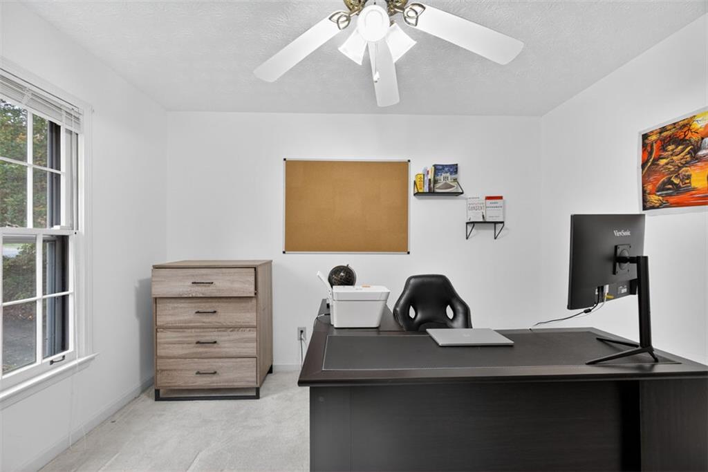 2222 Amber Creek Trail Buford, GA 30519 - Photo 33 of 51 a view of a workspace with furniture and a window