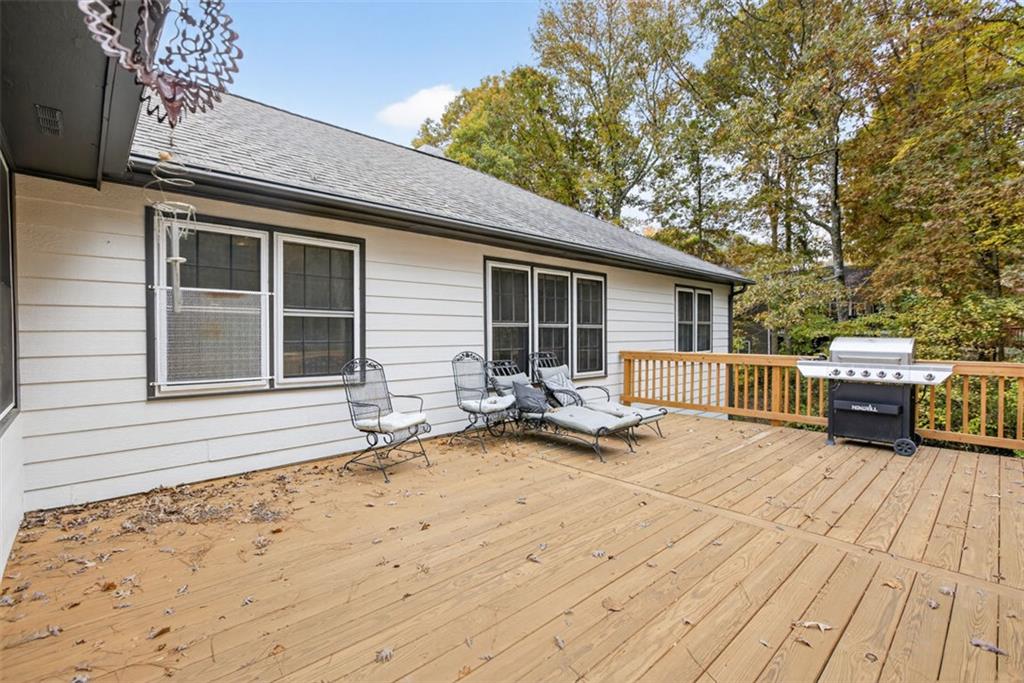 2222 Amber Creek Trail Buford, GA 30519 - Photo 39 of 51 a view of a house with wooden deck and barbeque oven