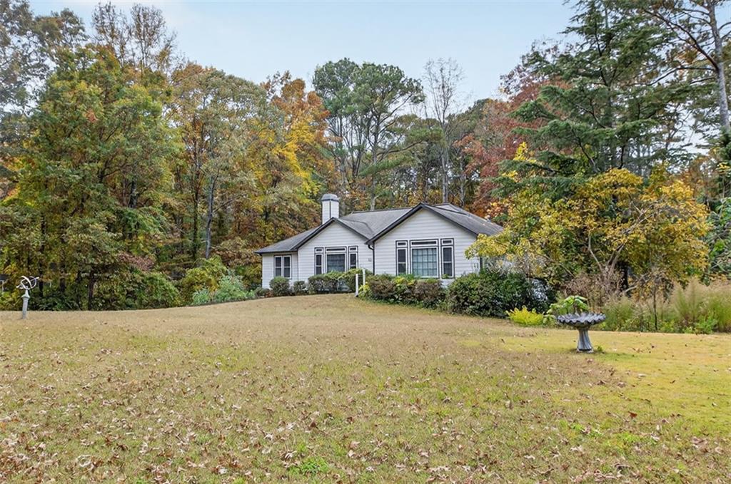 2222 Amber Creek Trail Buford, GA 30519 - Photo 42 of 51 a view of a house with a yard