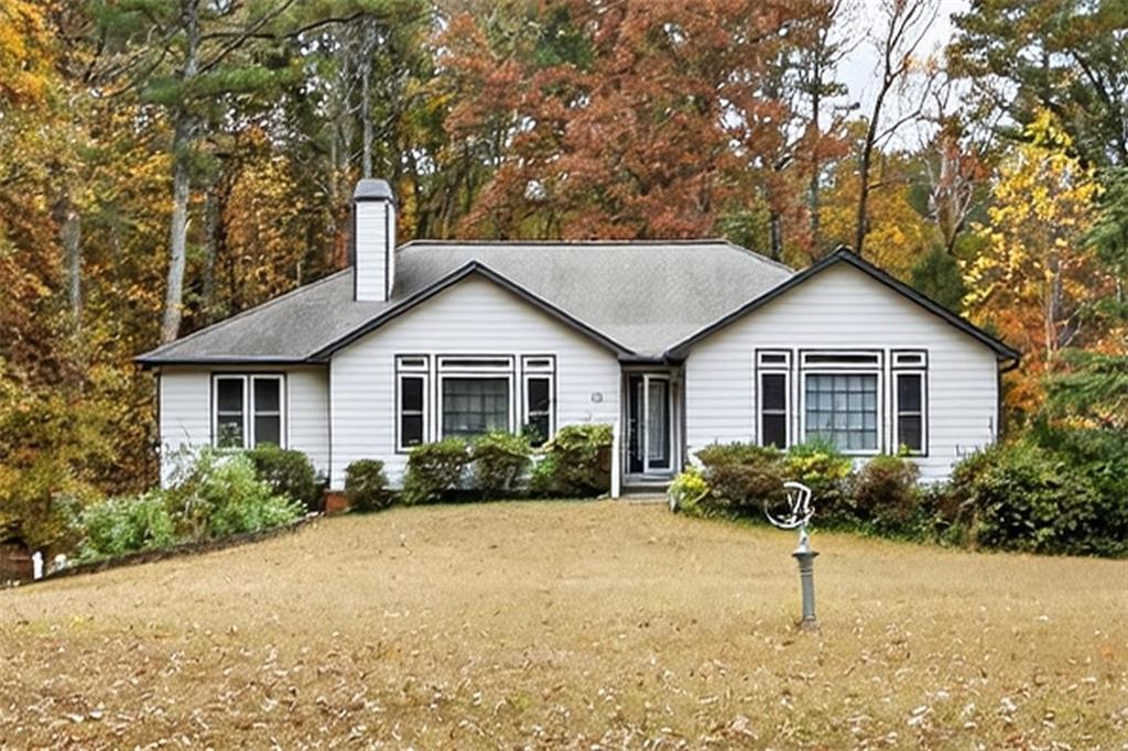 2222 Amber Creek Trail Buford, GA 30519 - Photo 43 of 51 a front view of house with yard and green space