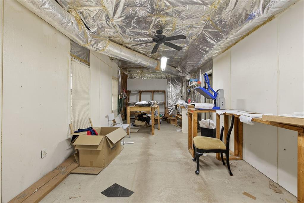 2222 Amber Creek Trail Buford, GA 30519 - Photo 48 of 51 a living room with furniture and a chandelier