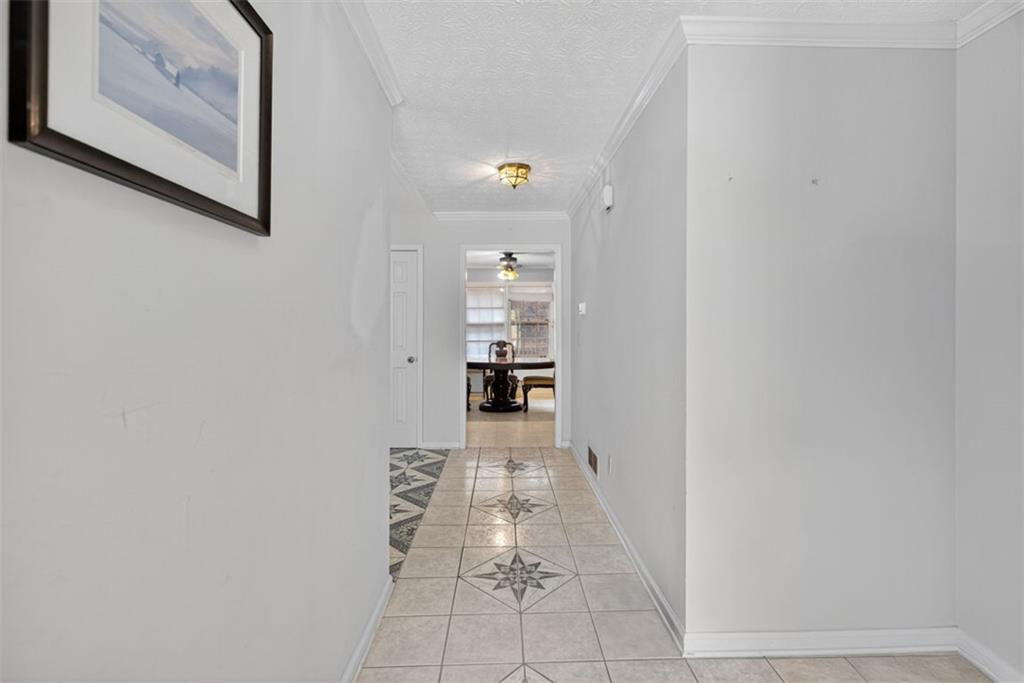 2222 Amber Creek Trail Buford, GA 30519 - Photo 5 of 51 a view of a hallway with wooden floor and a bathroom