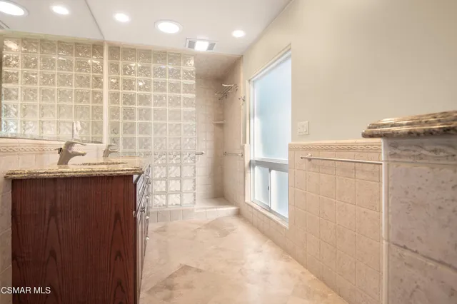 a bathroom with a sink and a shower