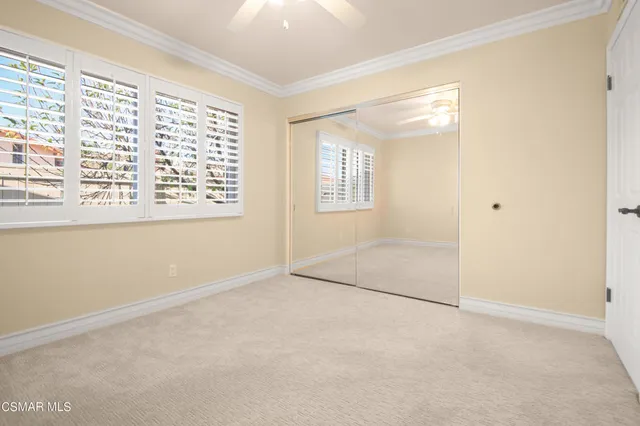 an empty room with a empty space and windows