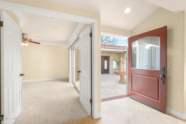 a view of a hallway to a livingroom and a furniture