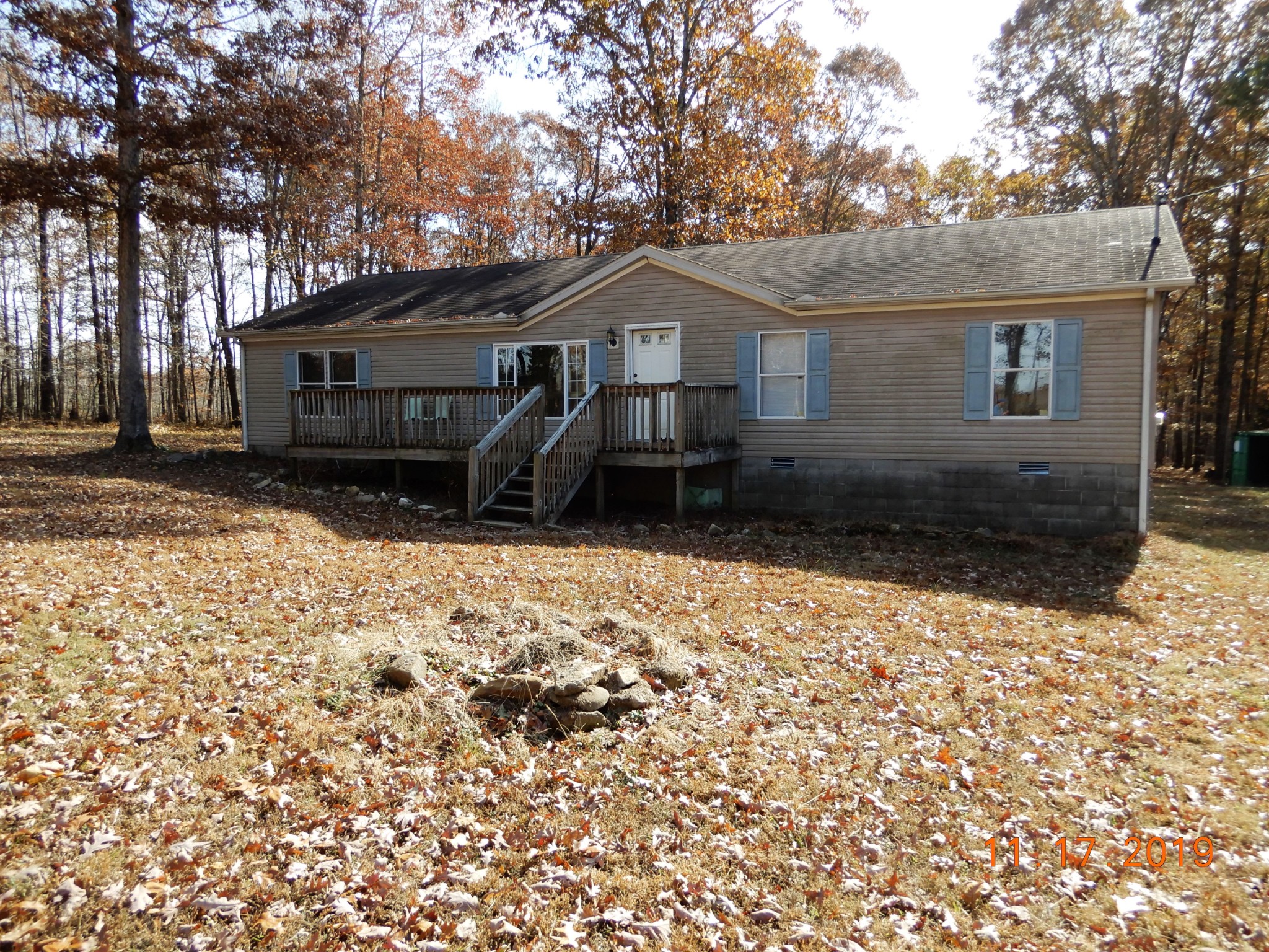 10408 Wilder Point Road Bon Aqua, TN 37025 - Photo 1 of 27 a front view of a house with a yard