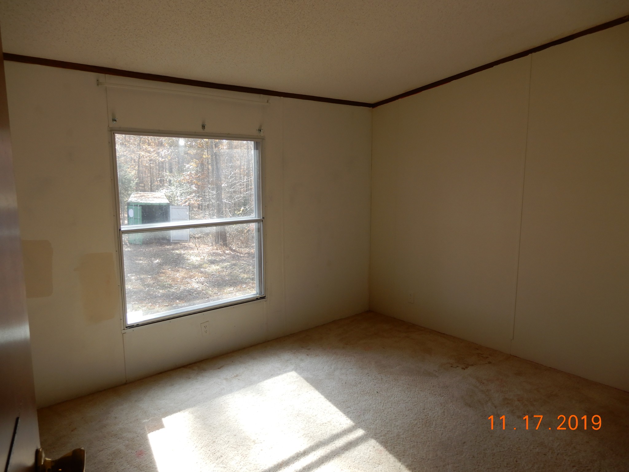 10408 Wilder Point Road Bon Aqua, TN 37025 - Photo 11 of 27 a view of an empty room with a window