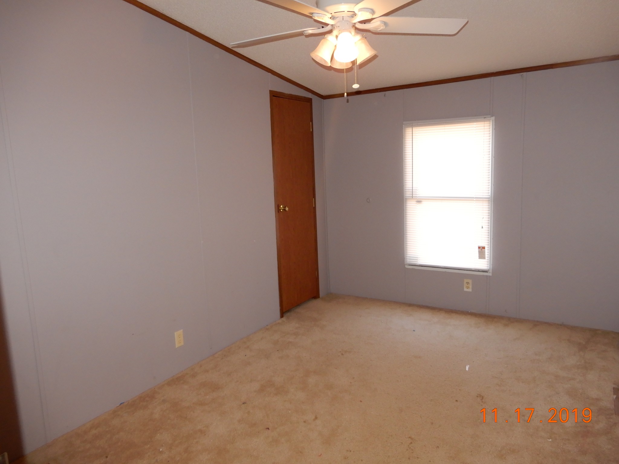 10408 Wilder Point Road Bon Aqua, TN 37025 - Photo 13 of 27 an empty room with a window and a fan