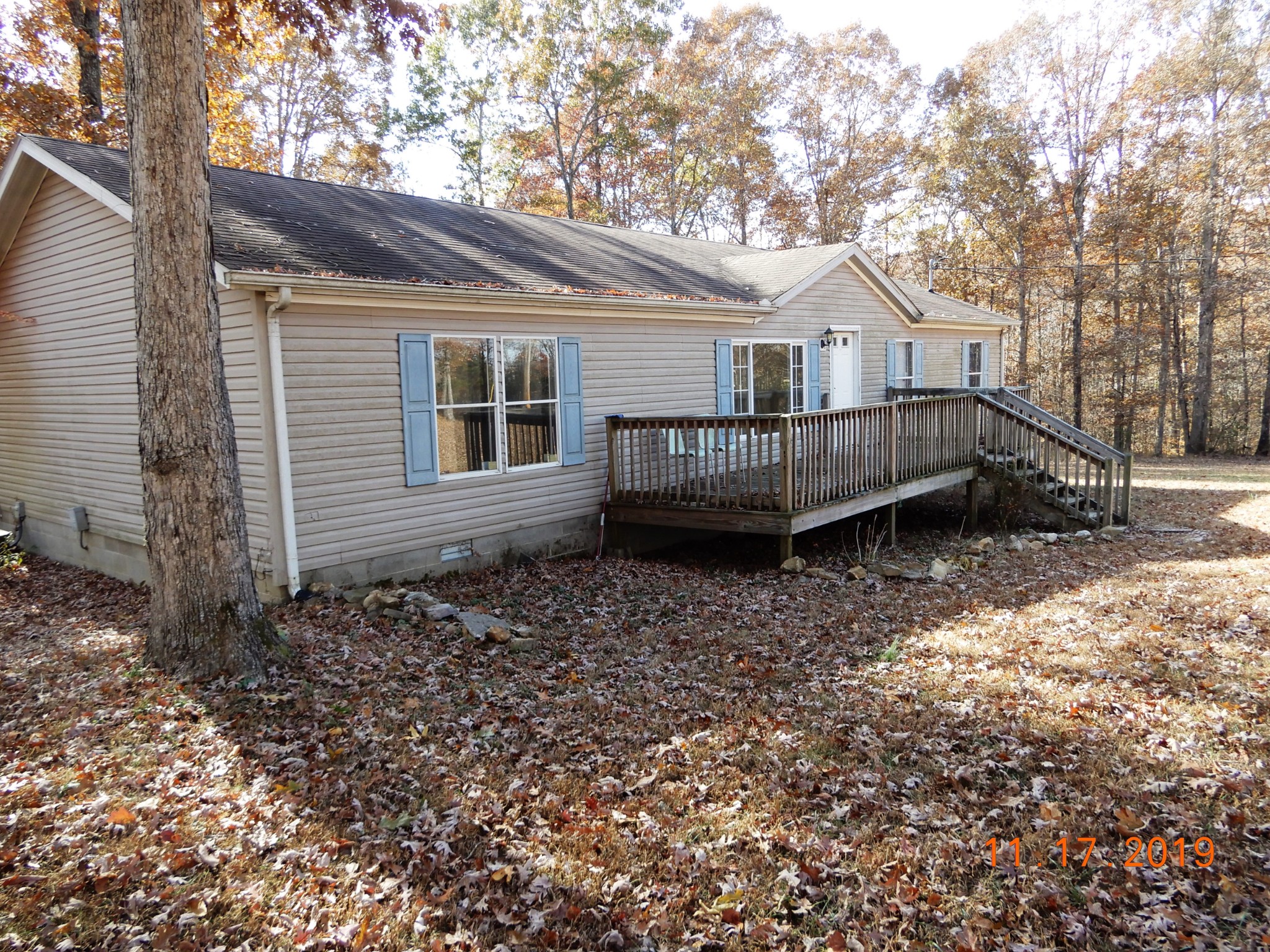 10408 Wilder Point Road Bon Aqua, TN 37025 - Photo 21 of 27 a front view of a house with a yard