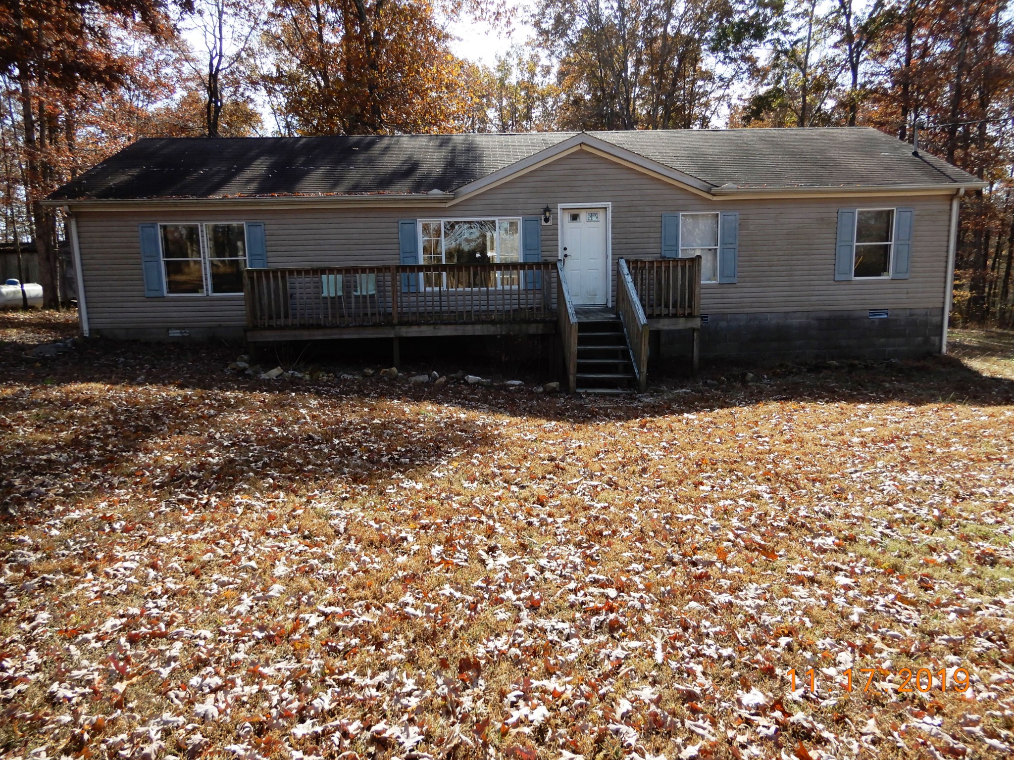 10408 Wilder Point Road Bon Aqua, TN 37025 - Photo 23 of 27 front view of a house with a yard