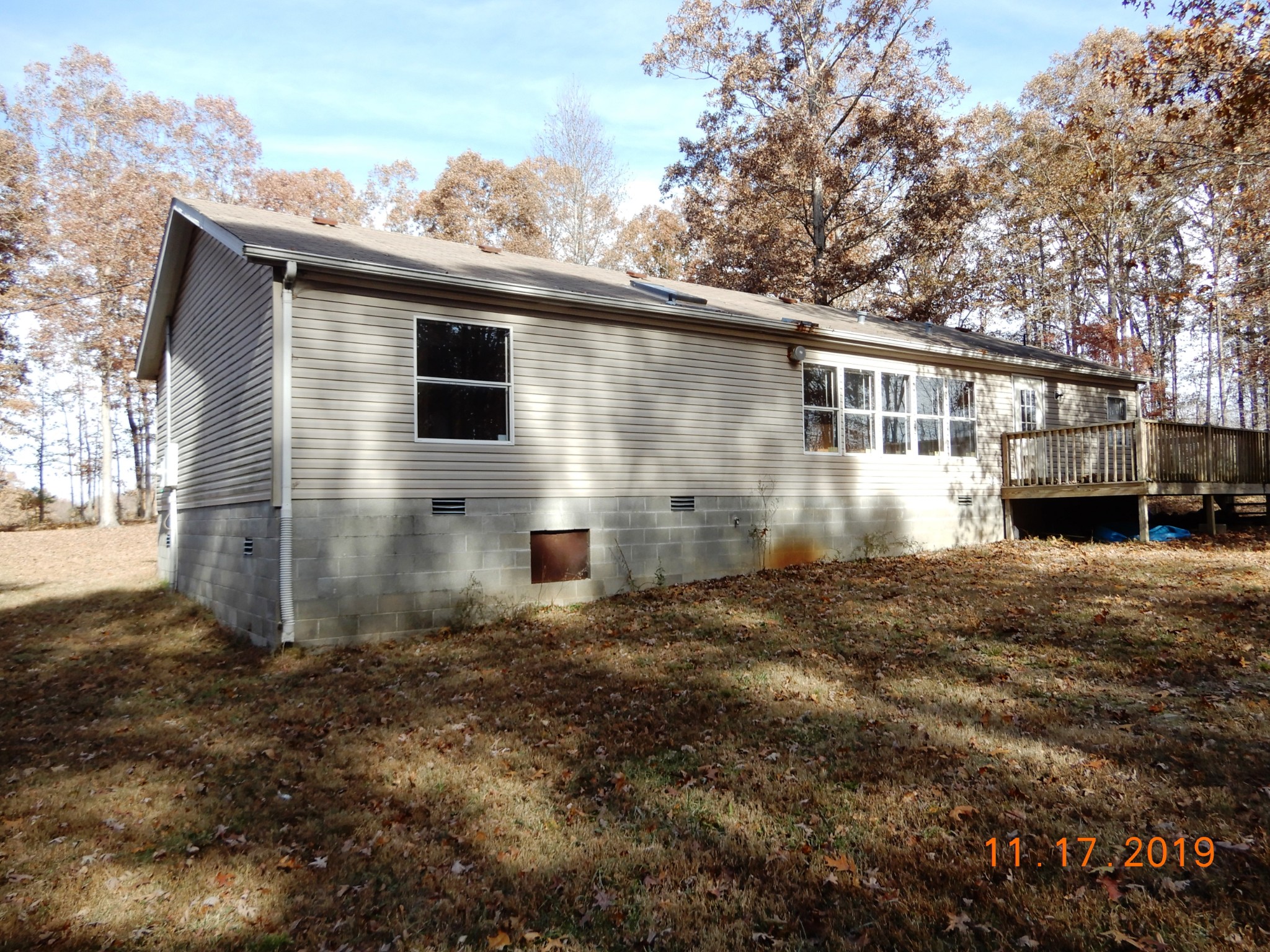 10408 Wilder Point Road Bon Aqua, TN 37025 - Photo 25 of 27 a view of a house with a yard