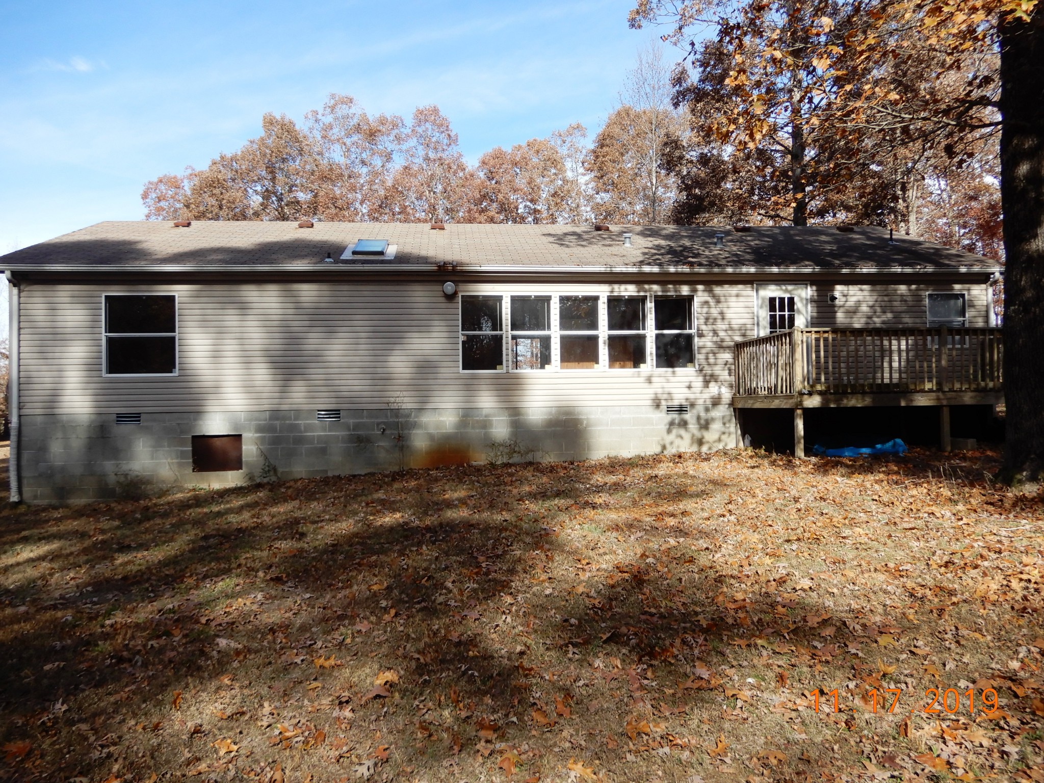10408 Wilder Point Road Bon Aqua, TN 37025 - Photo 26 of 27 a front view of a house with a yard