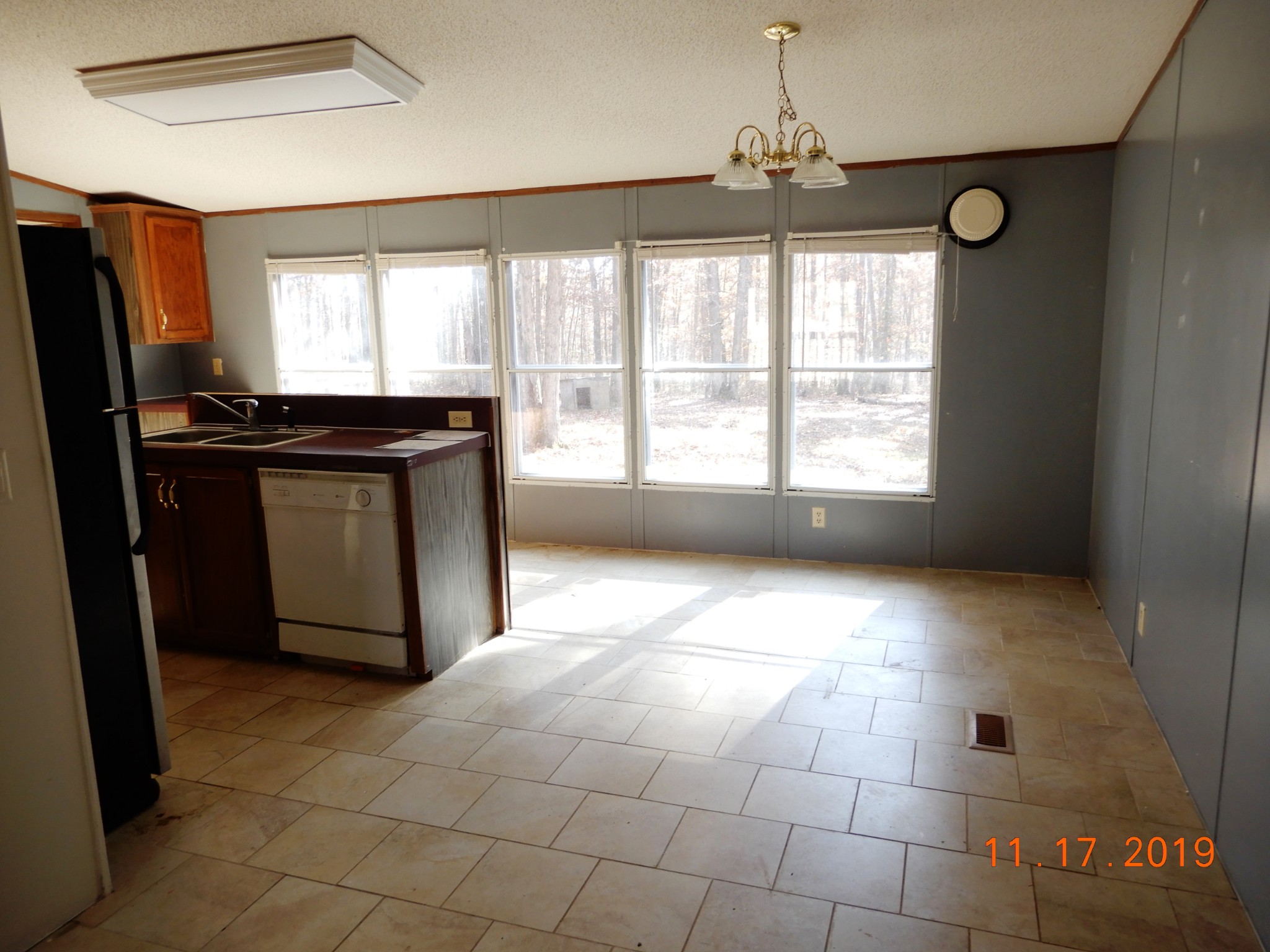 10408 Wilder Point Road Bon Aqua, TN 37025 - Photo 4 of 27 a kitchen with granite countertop a stove a sink and a refrigerator