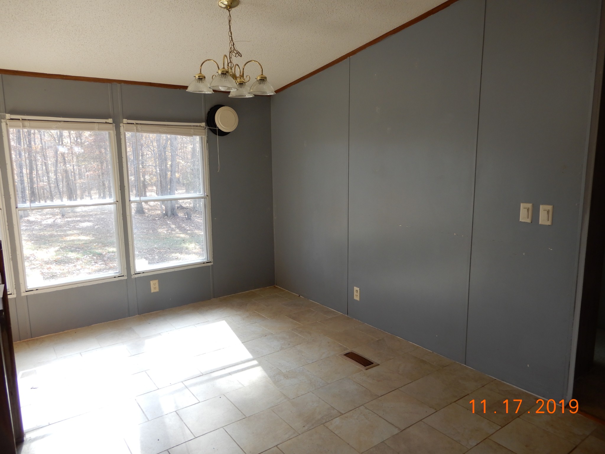 10408 Wilder Point Road Bon Aqua, TN 37025 - Photo 5 of 27 a view of an empty room with a window