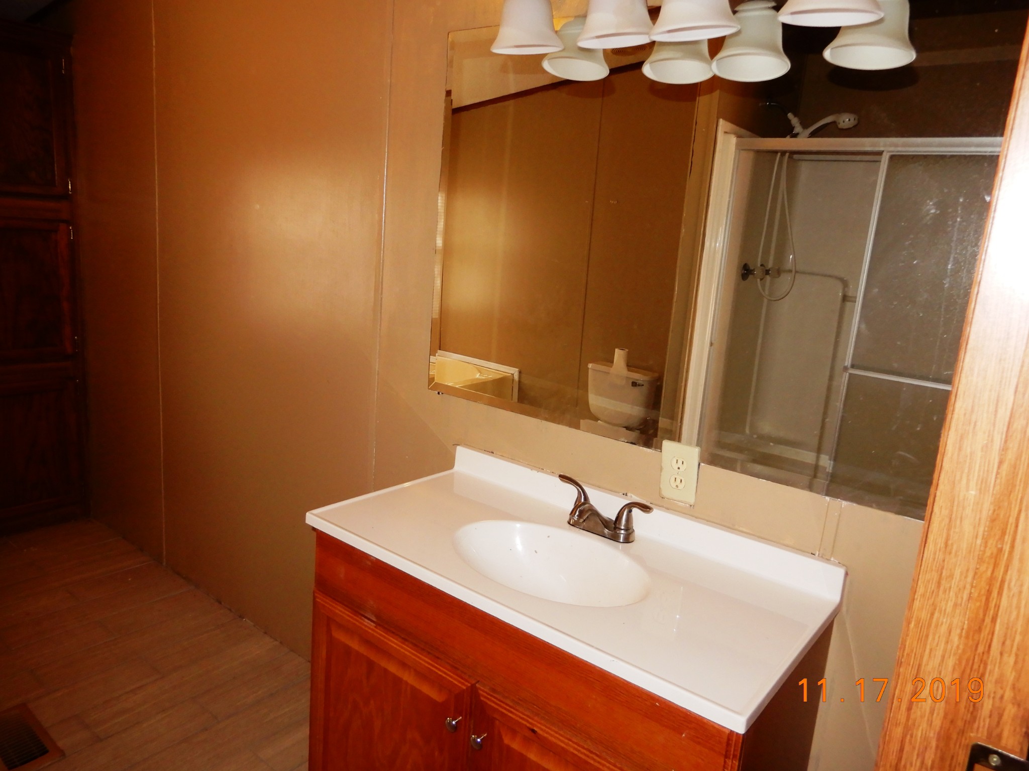 10408 Wilder Point Road Bon Aqua, TN 37025 - Photo 10 of 27 a bathroom with a sink and a mirror