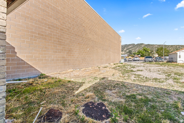 69 South Main Street Manti, UT 84642 - Photo 14 of 44 Expansive lot featuring a tan brick block building