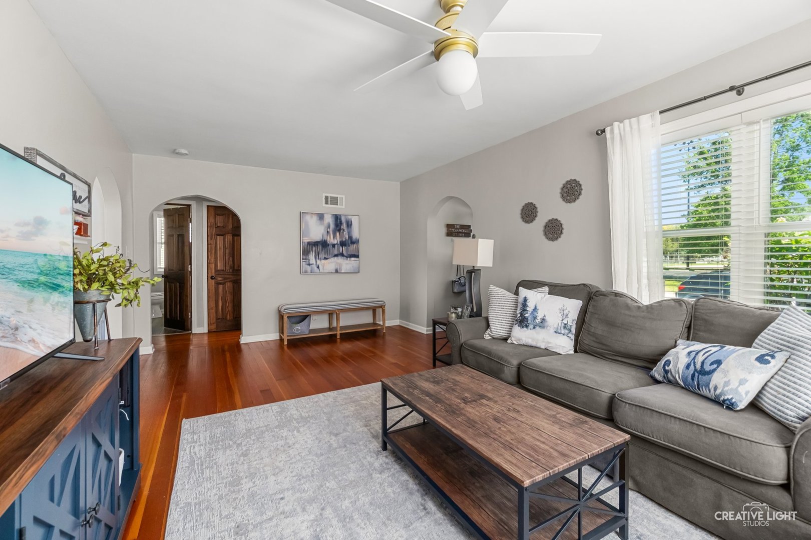 1606 Clark Street DeKalb, IL 60115 - Photo 2 of 20 a living room with furniture and a large window