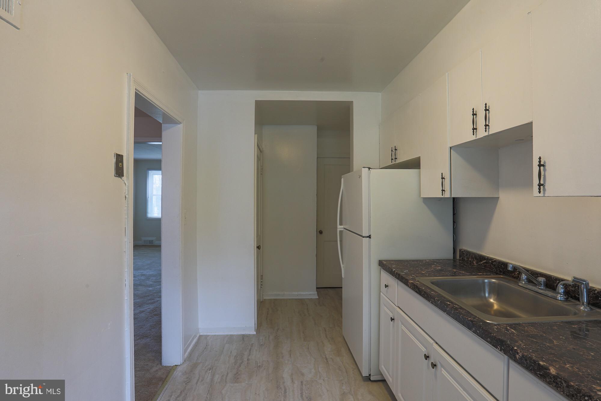 1304 East Cold Spring Lane Baltimore, MD 21239 - Photo 12 of 27 KITCHEN WITH NEW FLOORING