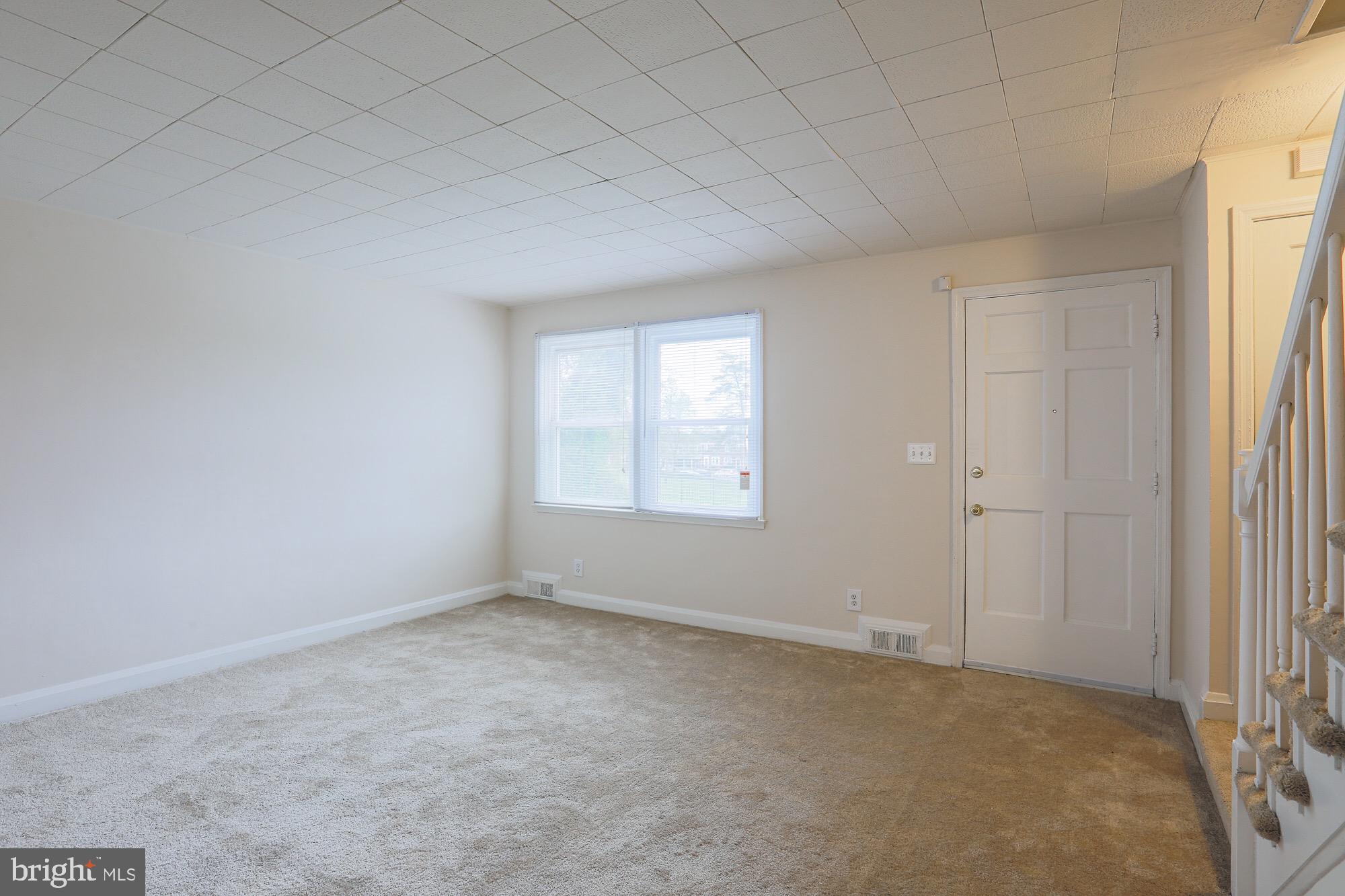 1304 East Cold Spring Lane Baltimore, MD 21239 - Photo 3 of 27 CARPETED LIVING ROOM