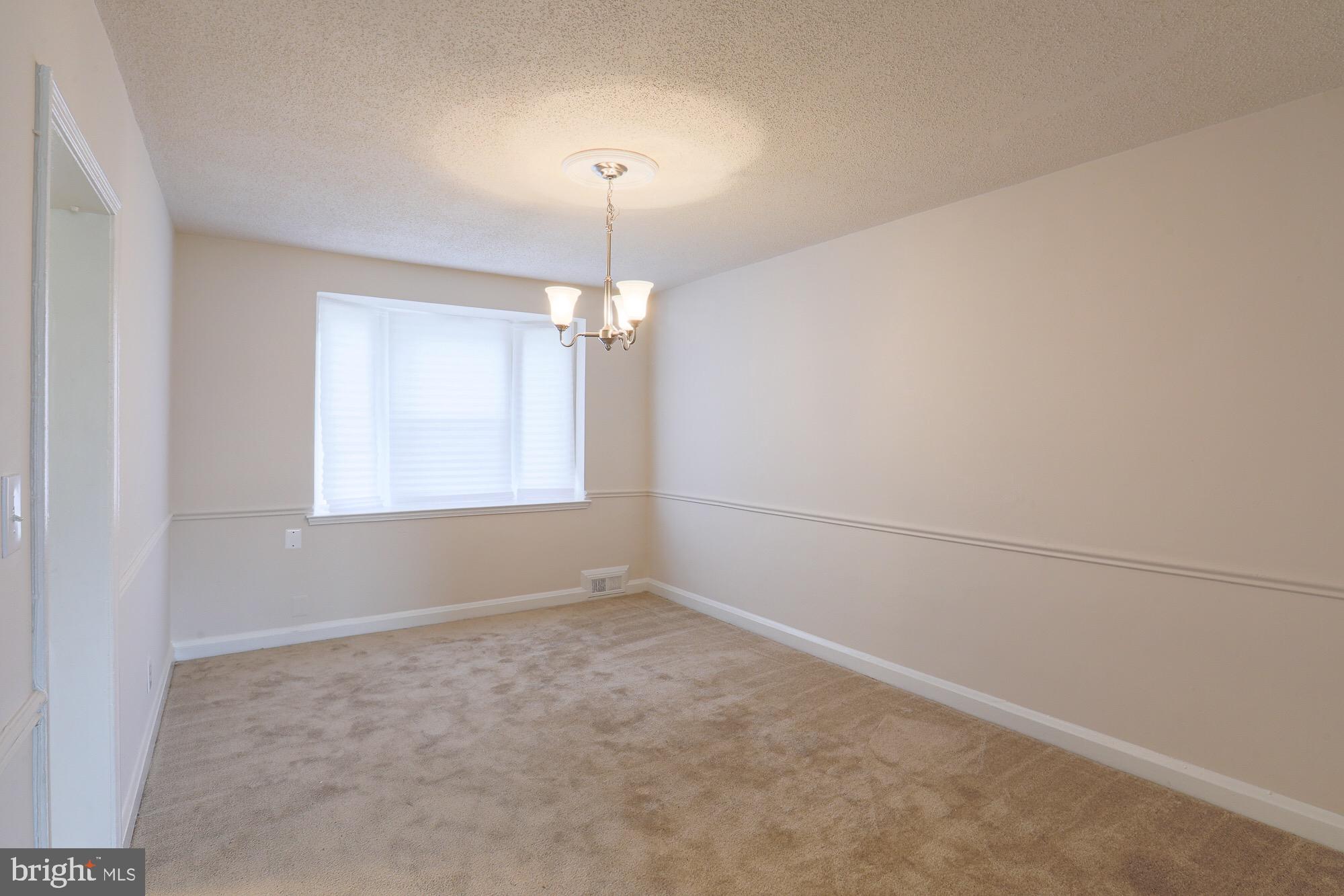 1304 East Cold Spring Lane Baltimore, MD 21239 - Photo 7 of 27 DINING ROOM WITH CHAIR RAILINGS
