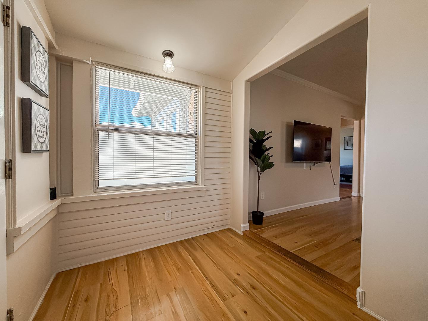 558 A Street Hayward, CA 94541 - Photo 2 of 37 a view of a livingroom with wooden floor and a window