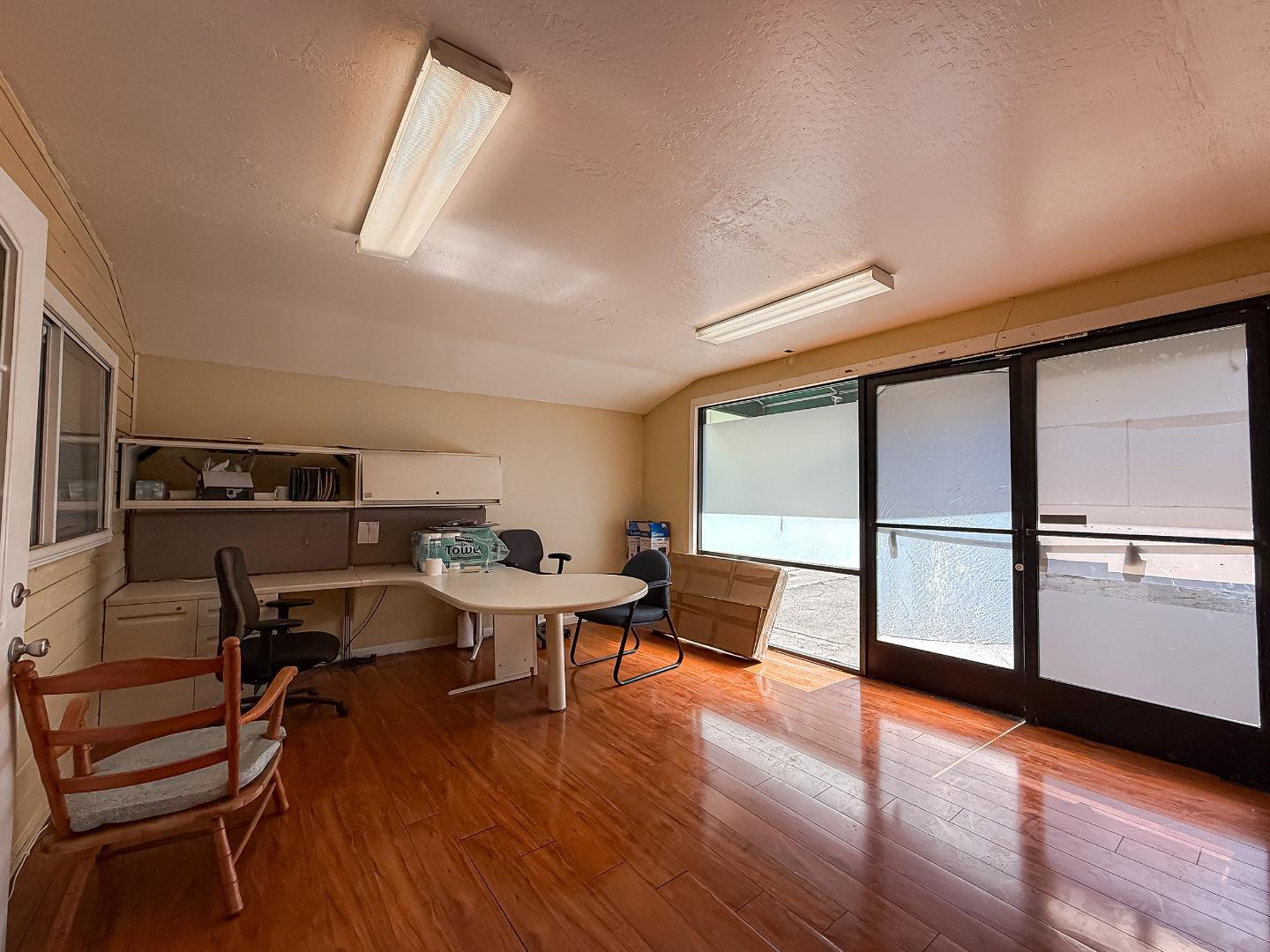 558 A Street Hayward, CA 94541 - Photo 23 of 37 a workspace with furniture window and wooden floor
