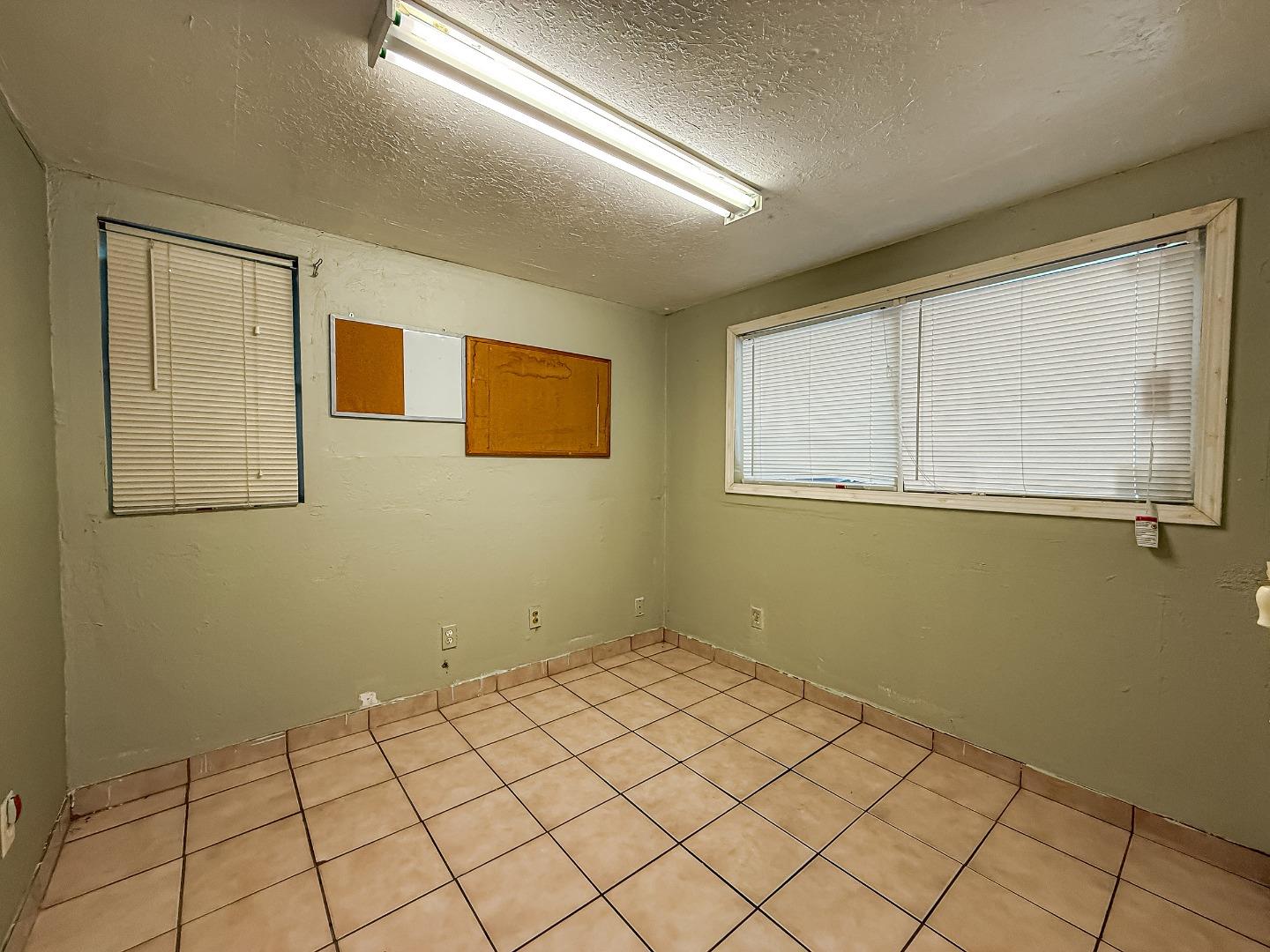 558 A Street Hayward, CA 94541 - Photo 27 of 37 a view of a room that has a window and wooden floor