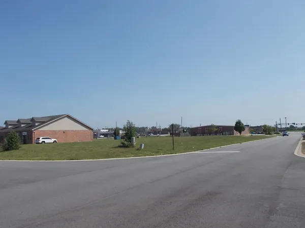a view of a field and near a houses