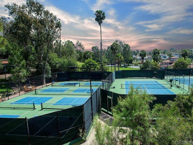 a view of a lake with a houses in the back