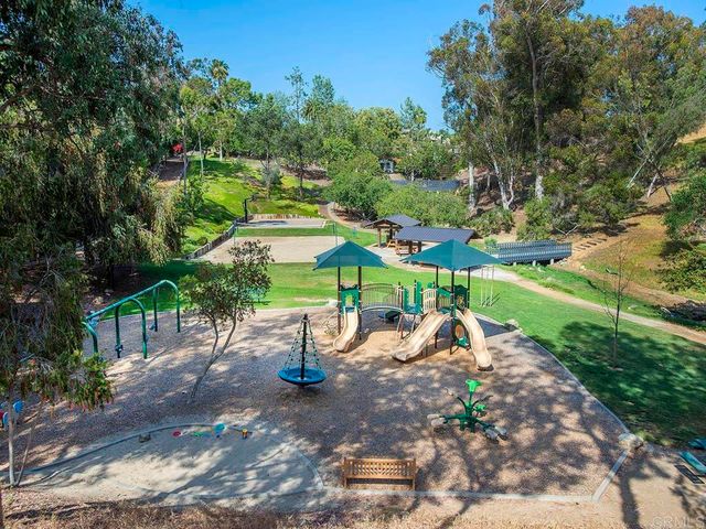 a street view with wooden fence and trees