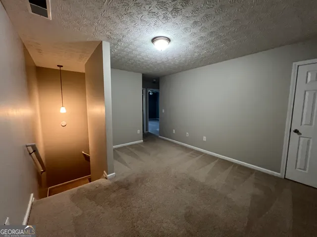 a view of a livingroom with a ceiling fan