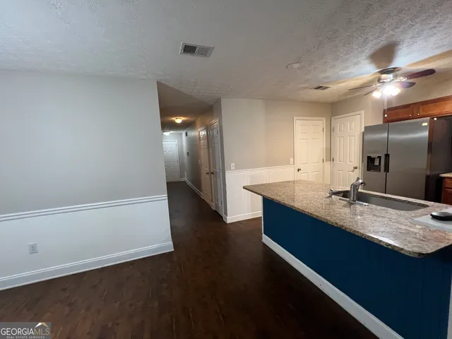 a large bathroom with a sink and a large mirror