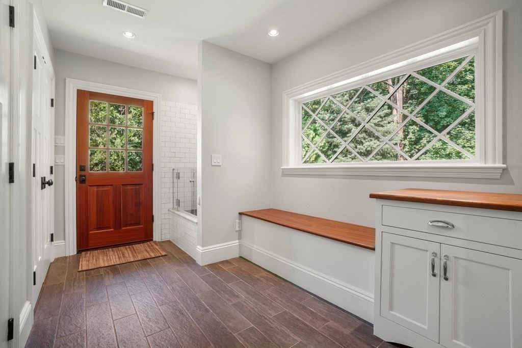 12 Swarthmore Road Wellesley, MA 02482 - Photo 12 of 38 a view of front door with hallway and wooden floor