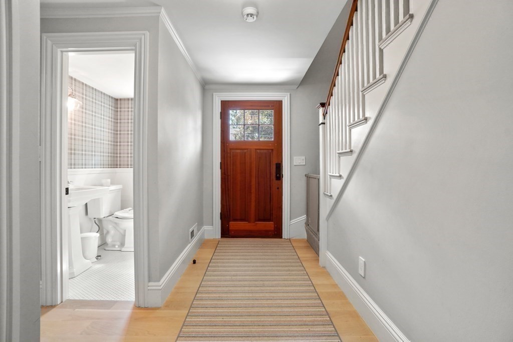 12 Swarthmore Road Wellesley, MA 02482 - Photo 22 of 38 a view of a hallway with a livingroom and a bathroom