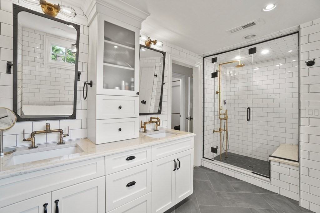 12 Swarthmore Road Wellesley, MA 02482 - Photo 26 of 38 a bathroom with a double vanity sink mirror double shower and a bathtub