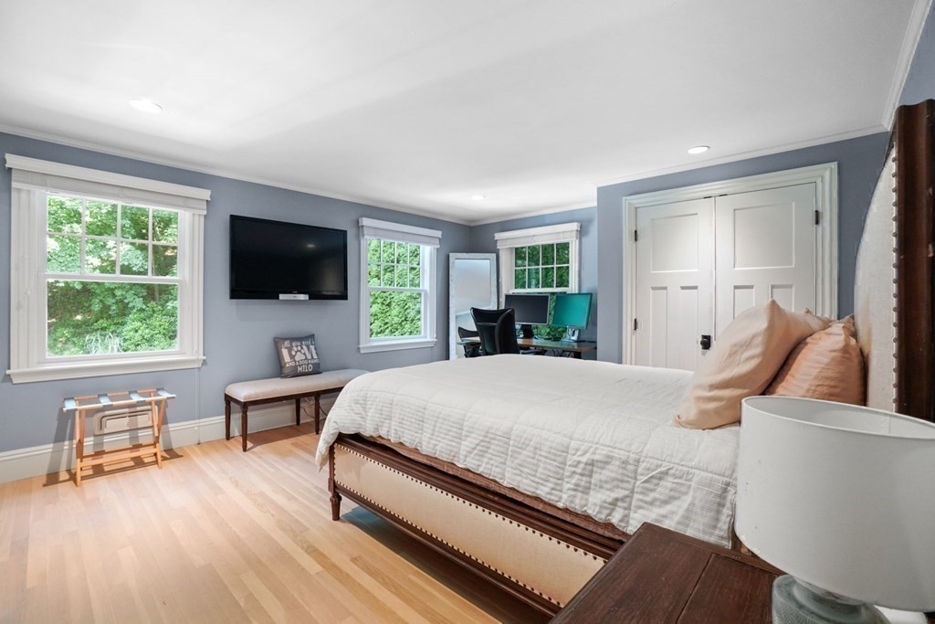 12 Swarthmore Road Wellesley, MA 02482 - Photo 30 of 38 a living room with furniture and a flat screen tv