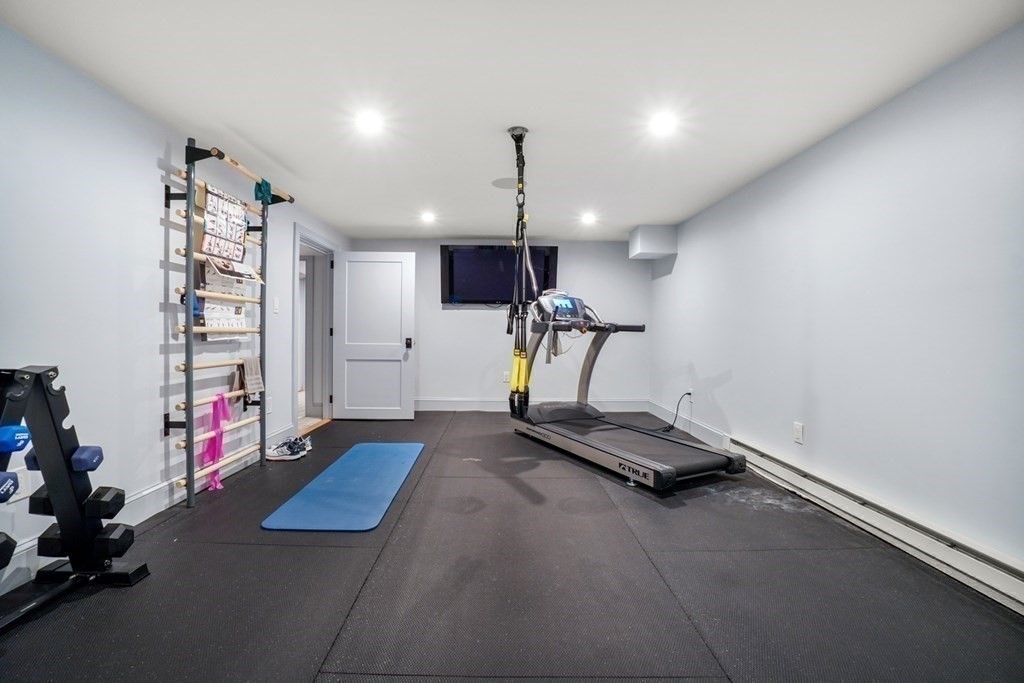 12 Swarthmore Road Wellesley, MA 02482 - Photo 34 of 38 a room with gym equipment and a window