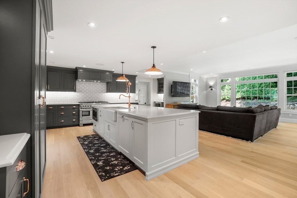 12 Swarthmore Road Wellesley, MA 02482 - Photo 5 of 38 a kitchen with stainless steel appliances a sink and a stove