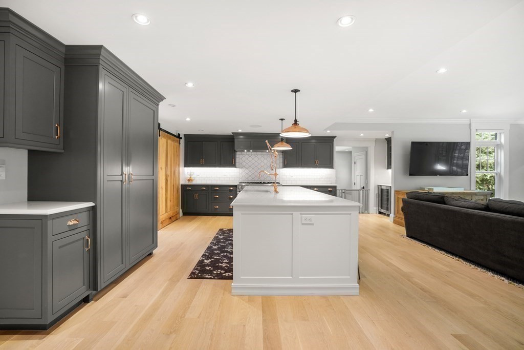 12 Swarthmore Road Wellesley, MA 02482 - Photo 6 of 38 a large kitchen with a large counter top appliances and cabinets