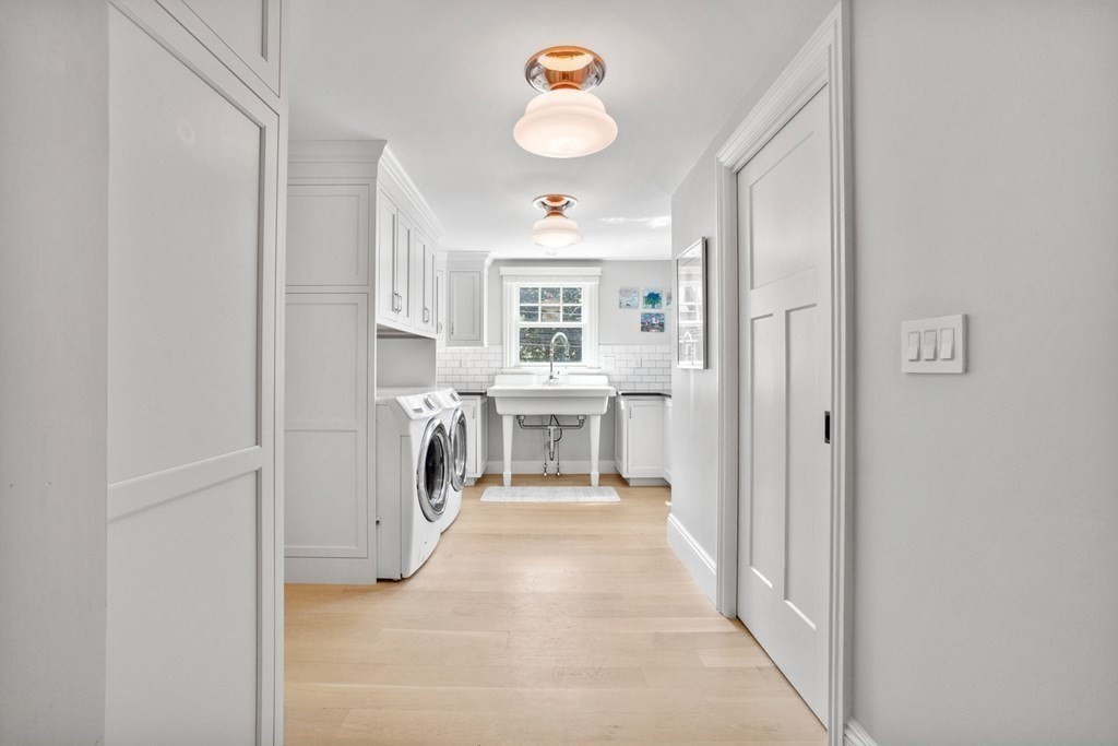 12 Swarthmore Road Wellesley, MA 02482 - Photo 10 of 38 a view of a hallway with closet and a fireplace