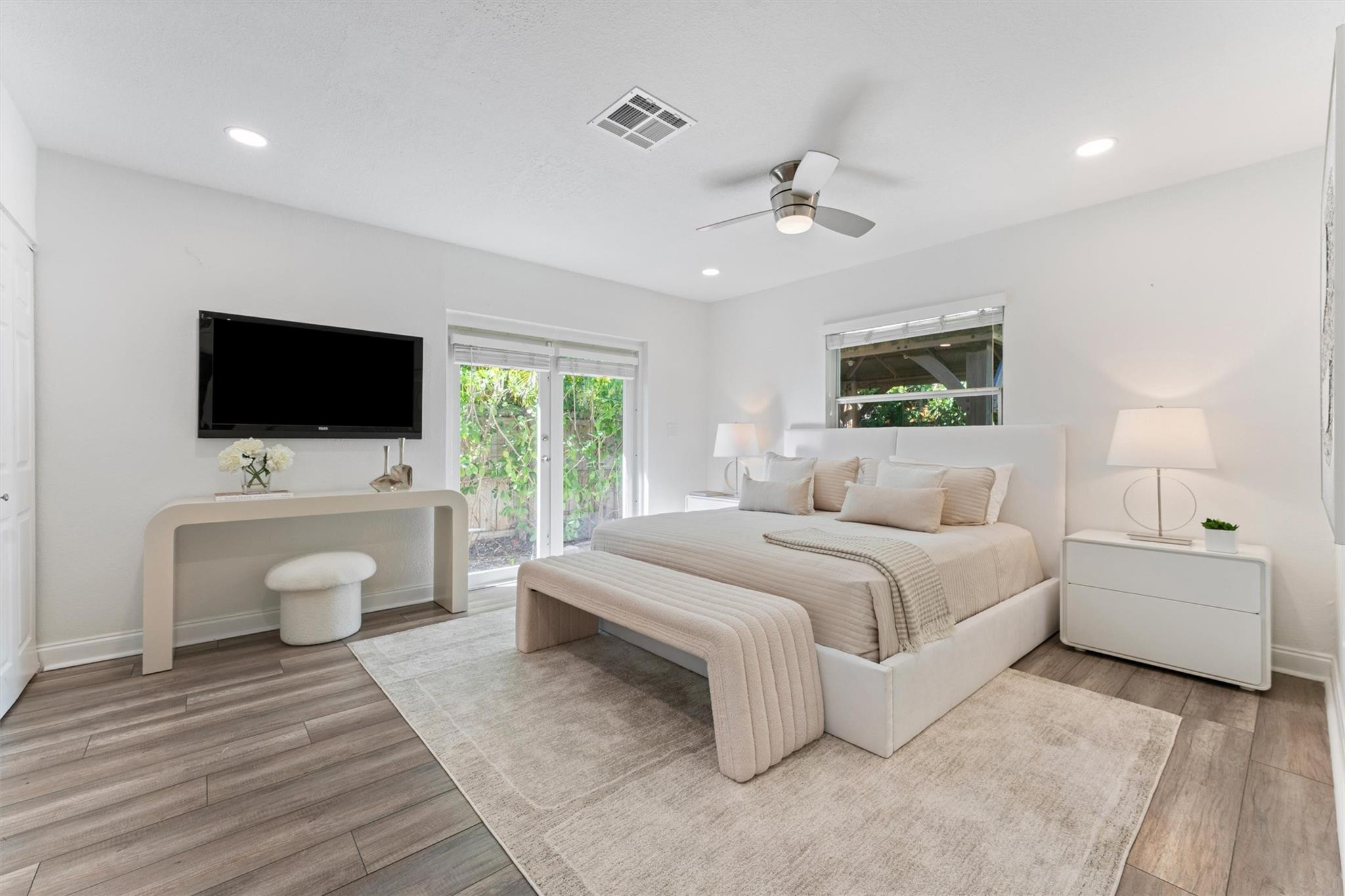 3203 Dover Road Pompano Beach, FL 33062 - Photo 16 of 45 a spacious bedroom with a bed and a flat screen tv