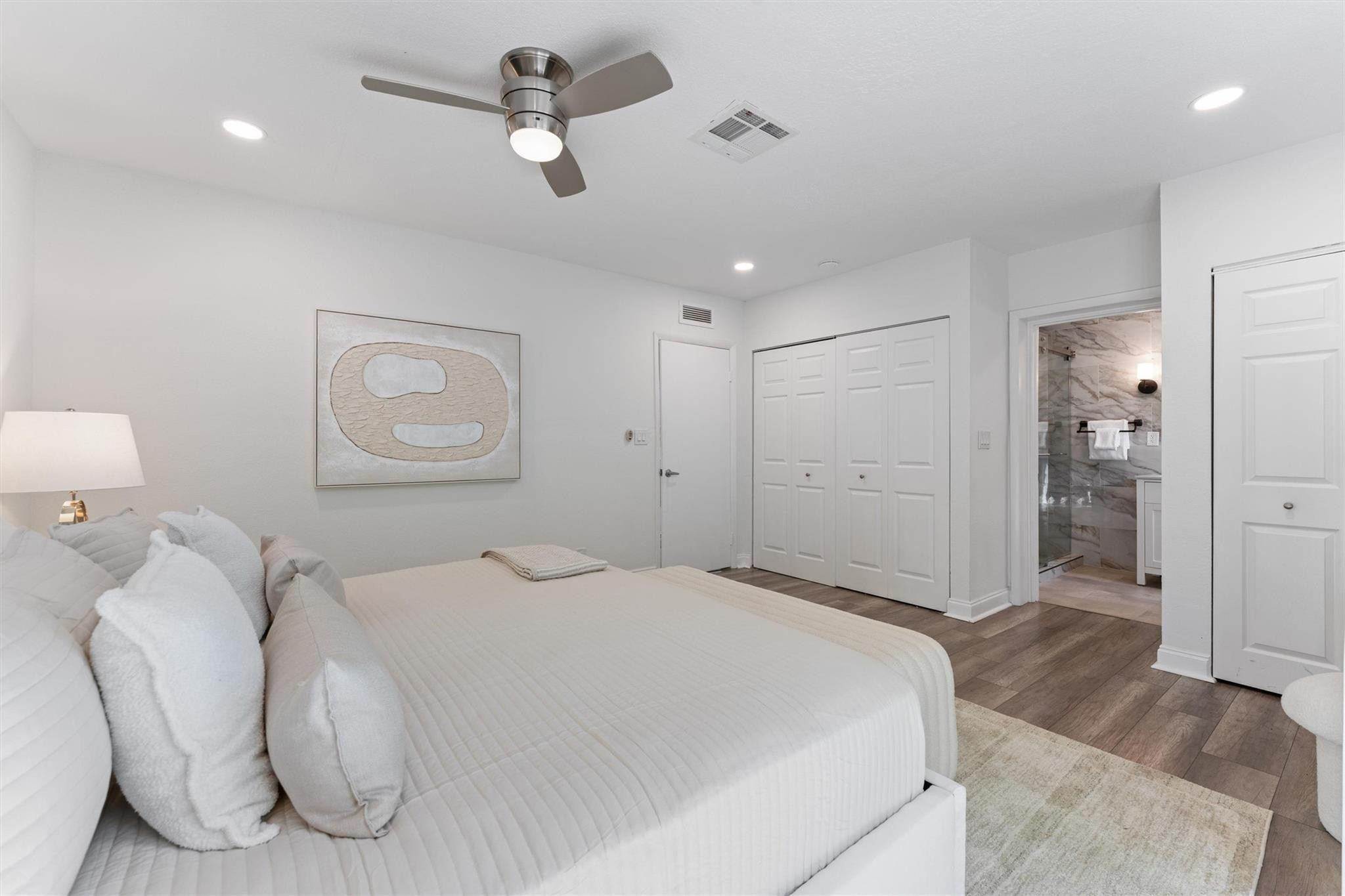 3203 Dover Road Pompano Beach, FL 33062 - Photo 17 of 45 a spacious bedroom with a bed and closet with mirror