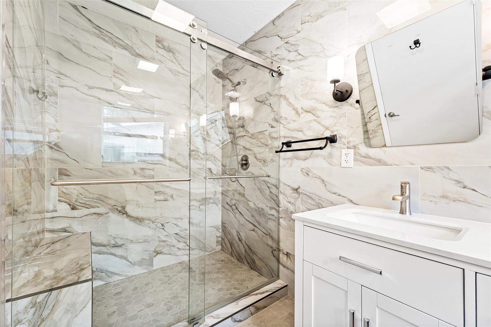 3203 Dover Road Pompano Beach, FL 33062 - Photo 19 of 45 a bathroom with a sink and a shower