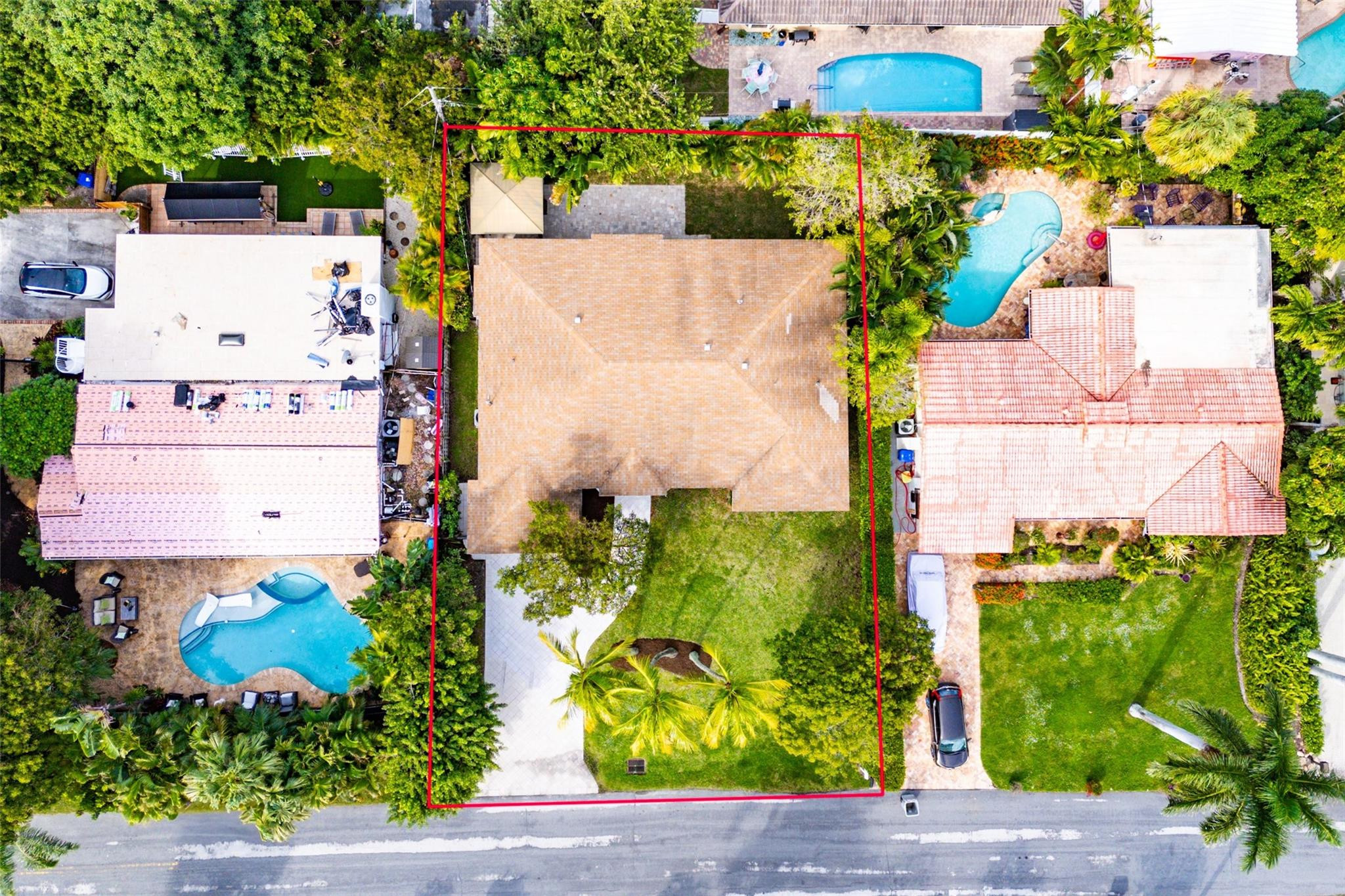 3203 Dover Road Pompano Beach, FL 33062 - Photo 40 of 45 an aerial view of a house with a yard and garden