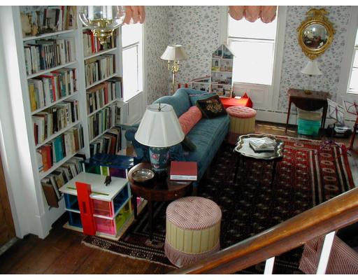332 Zoar Road Rowe, MA 01367 - Photo 7 of 14 a living room with furniture and a fireplace