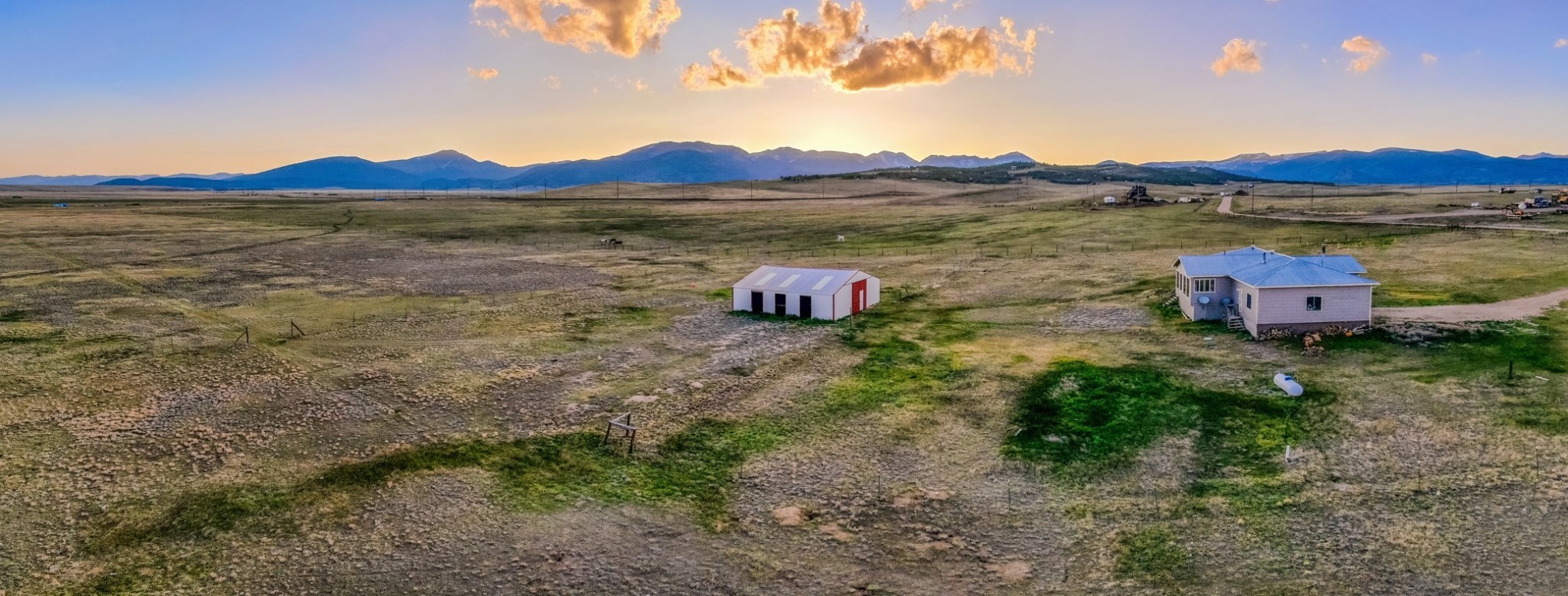 465 Litmer Road Jefferson, CO 80456 - Photo 25 of 50 Aerial view at dusk of a mountain view and a rural view