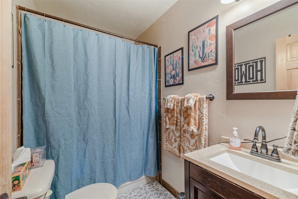465 Litmer Road Jefferson, CO 80456 - Photo 27 of 50 Full bathroom featuring vanity and a shower with curtain