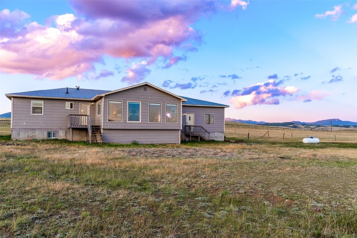 465 Litmer Road Jefferson, CO 80456 - Photo 44 of 50 Rear view of property featuring a metal roof and a mountain view